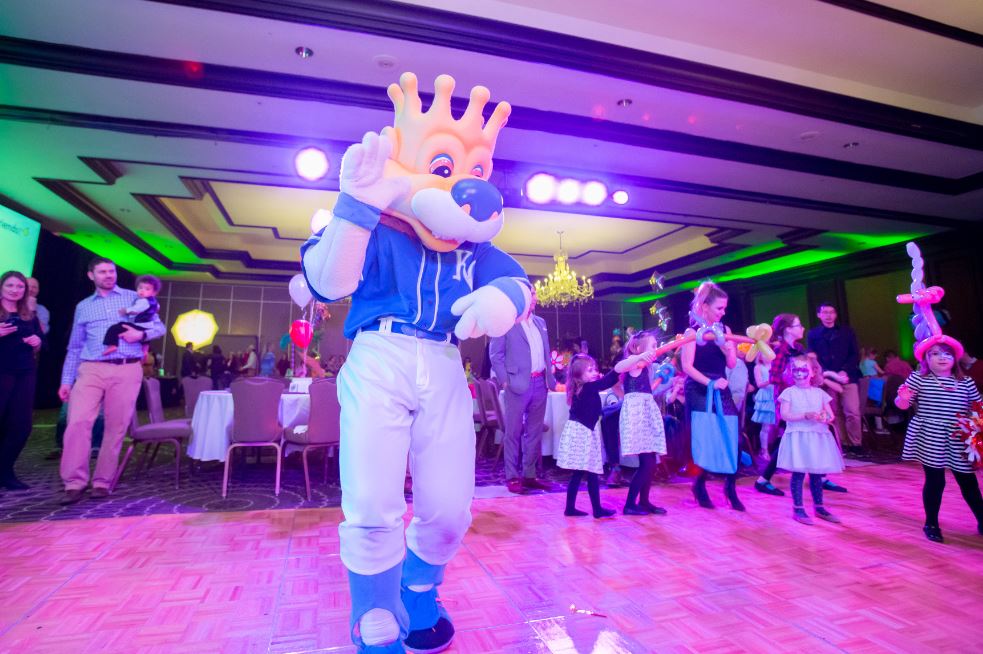 Slugger dancing with kids on the dance floor at Once Upon a Time