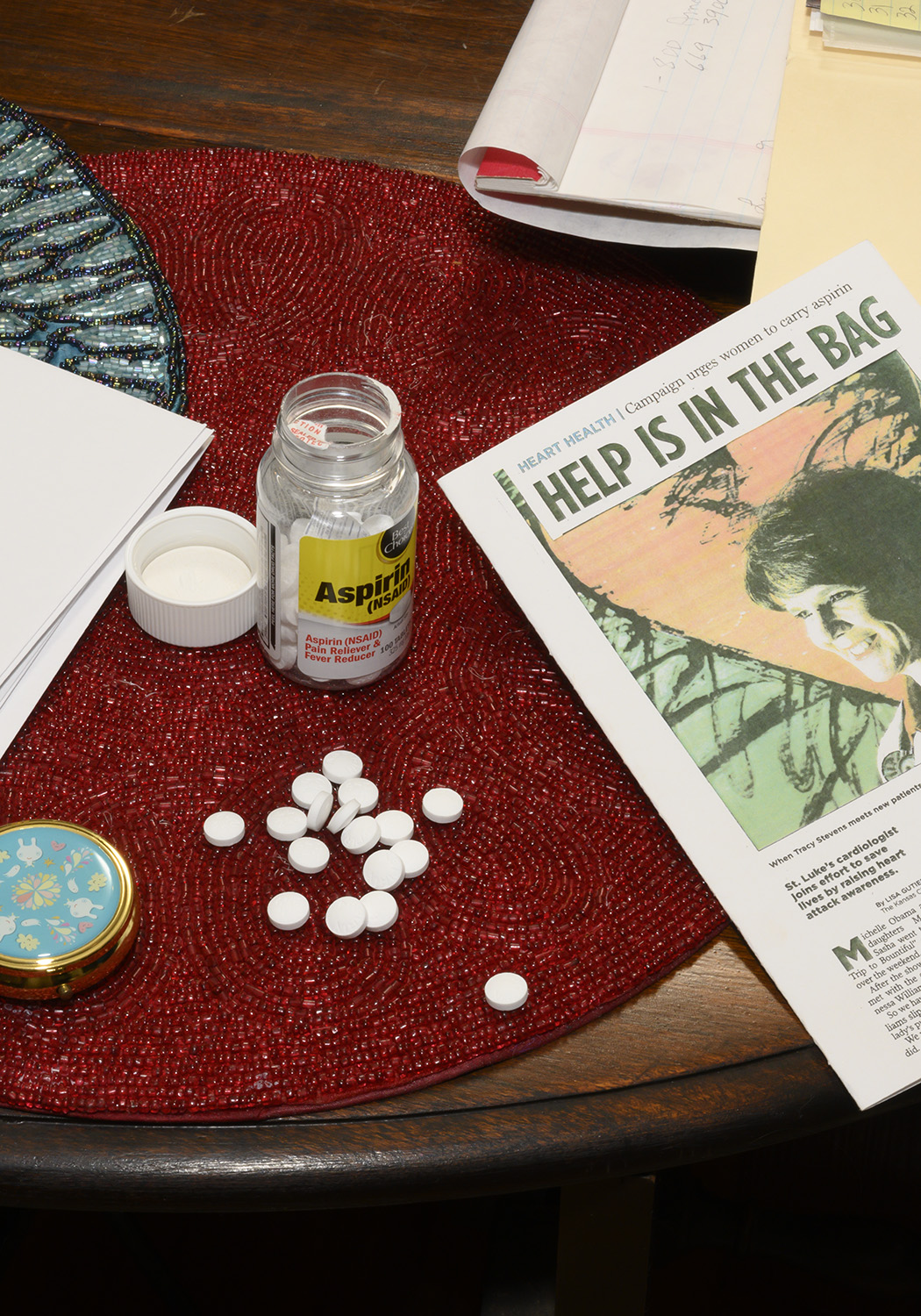 Aspirin and Dr. Stevens article that Dixie made into a card that reads, 'Help is in the Bag.'