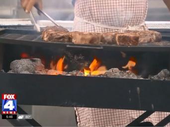 FOX 4 News. Man cooking steaks over a grill.