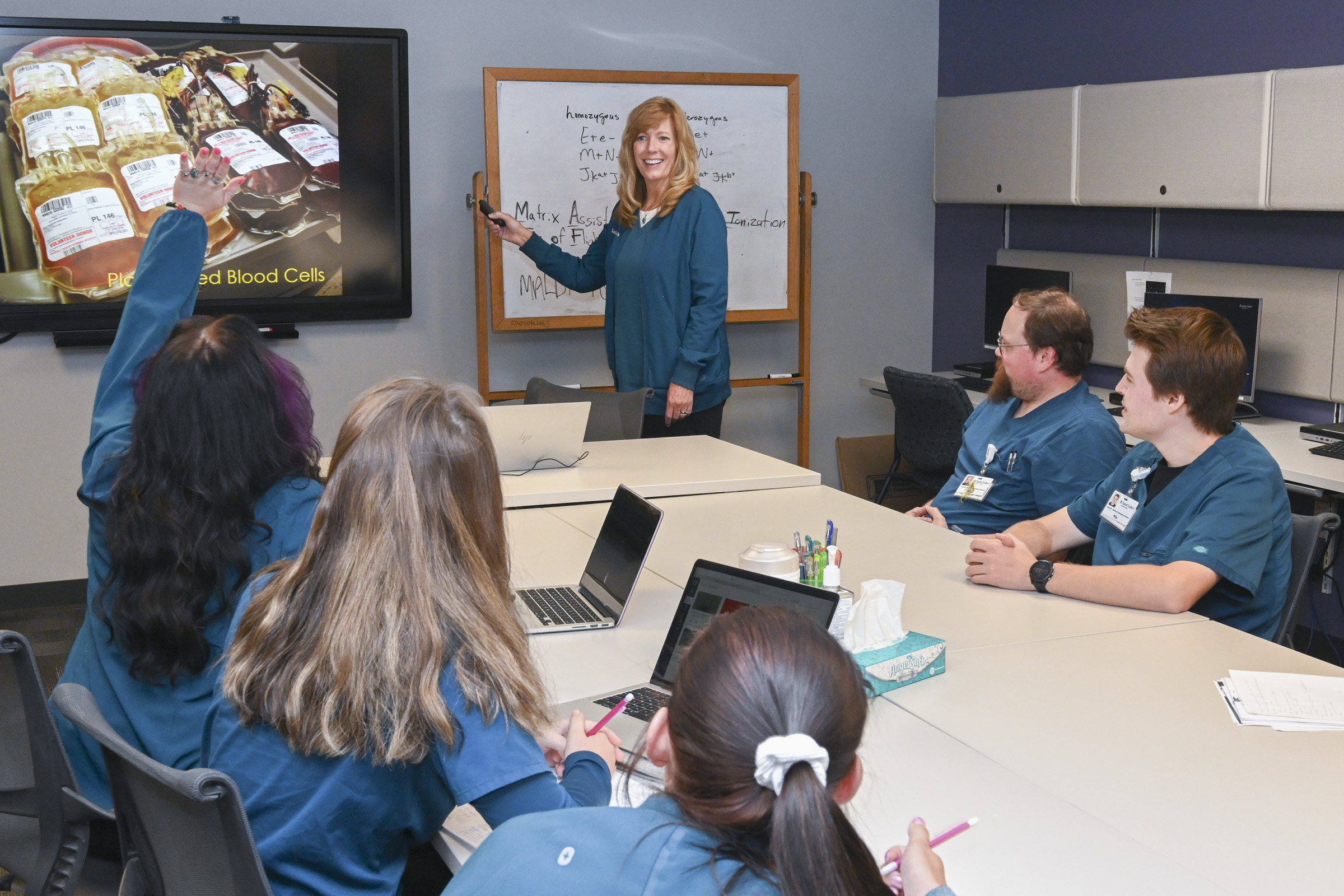 Medical Laboratory Science students looking intently at the instructor.
