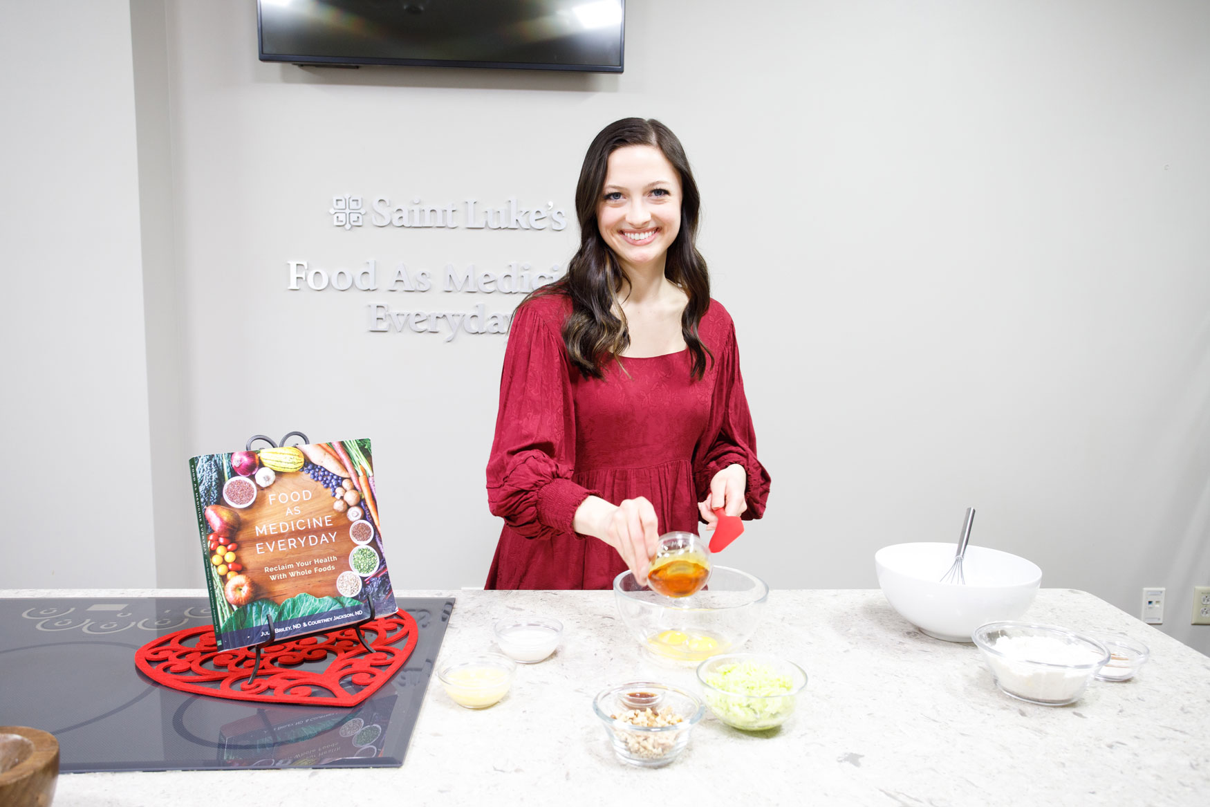 An instructor from the Food as Medicine Everyday Program is preparing a meal