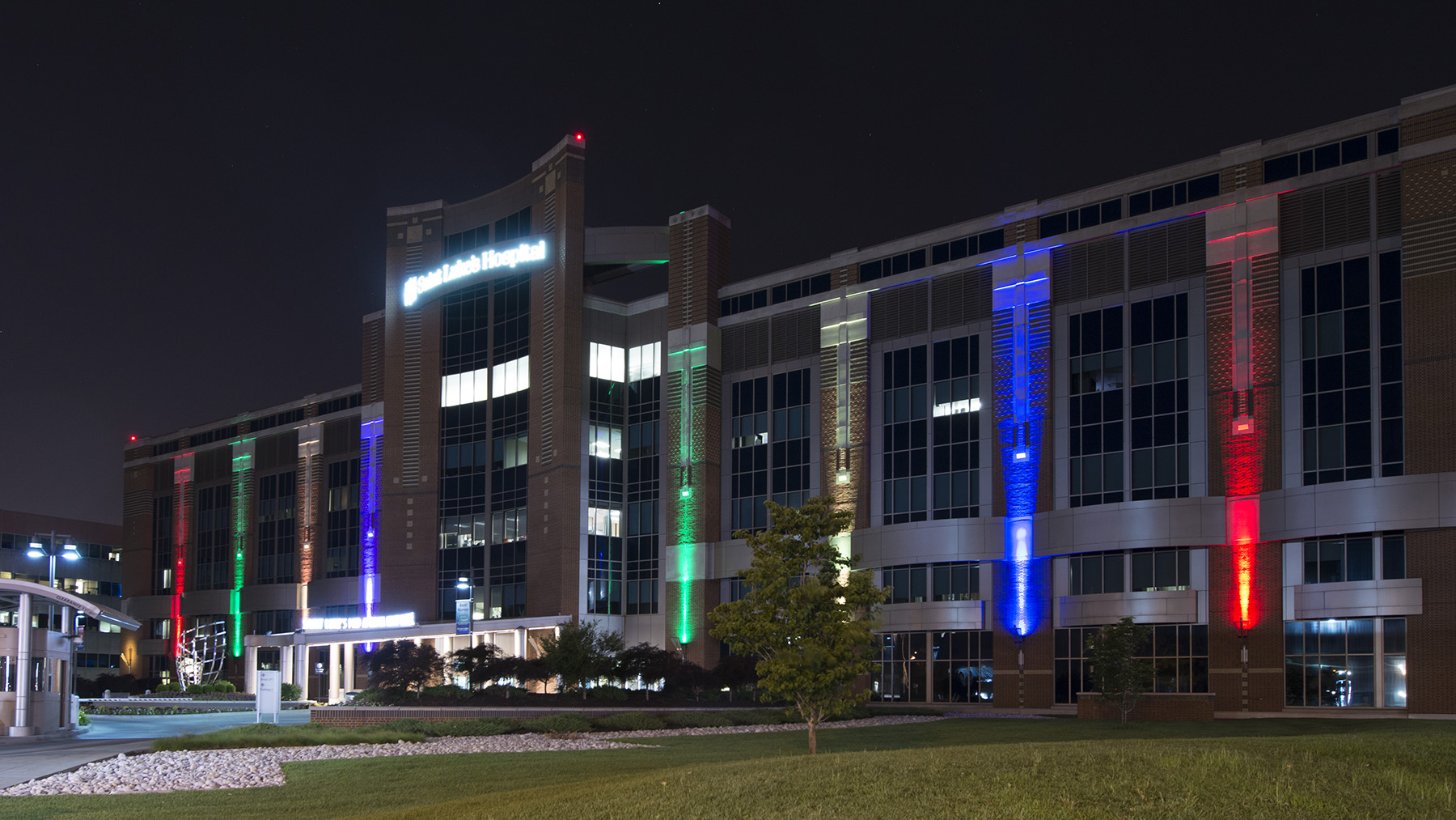 Saint Luke's Hospital of Kansas City is shown at light with rainbow lights.