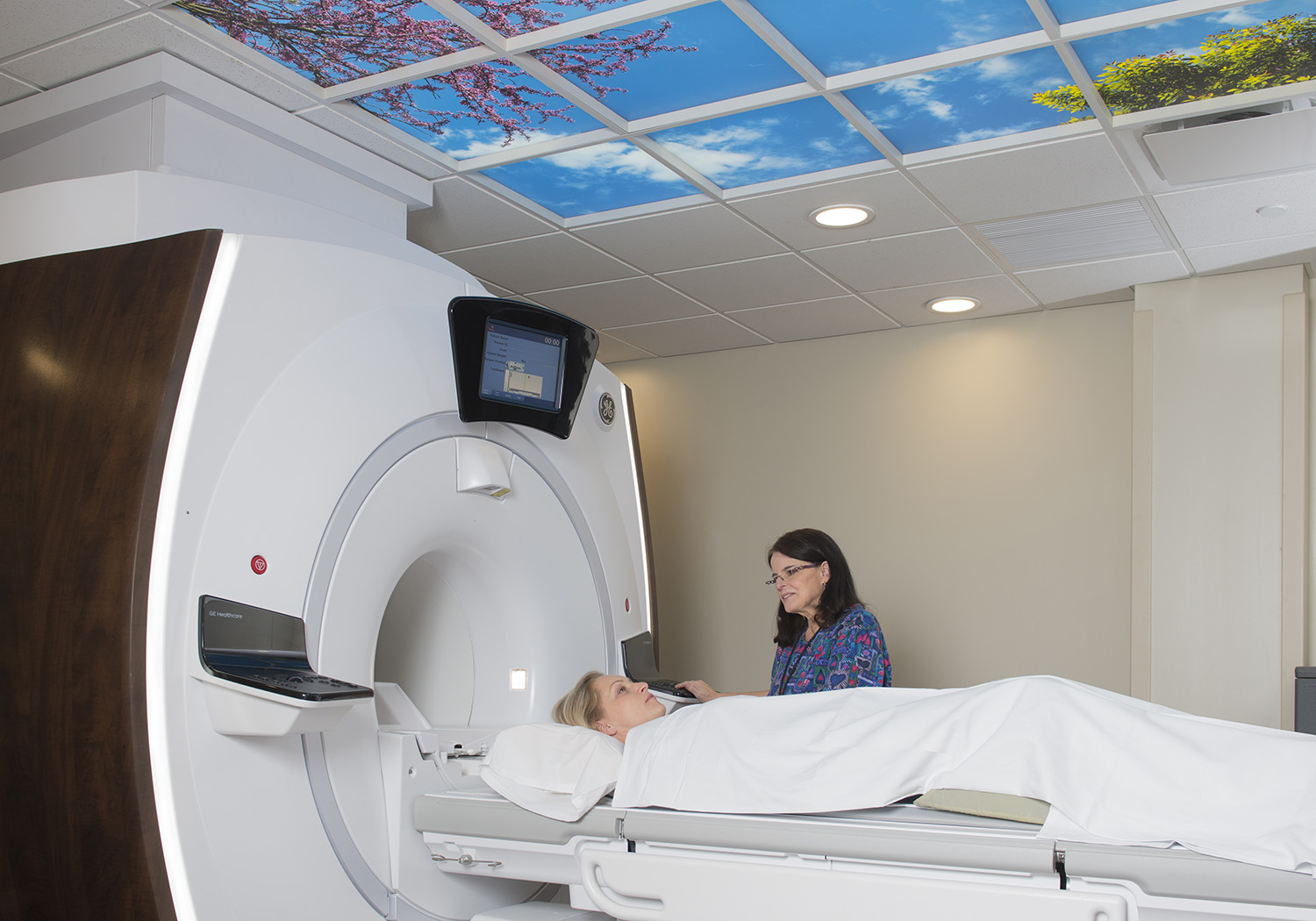 MRI scan is shown with a patient and technician