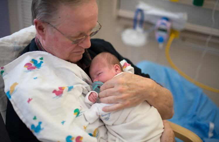 Bob McElwain of Kansas City, Mo., soothes fussy babies at Saint Luke's Hospital of Kansas City