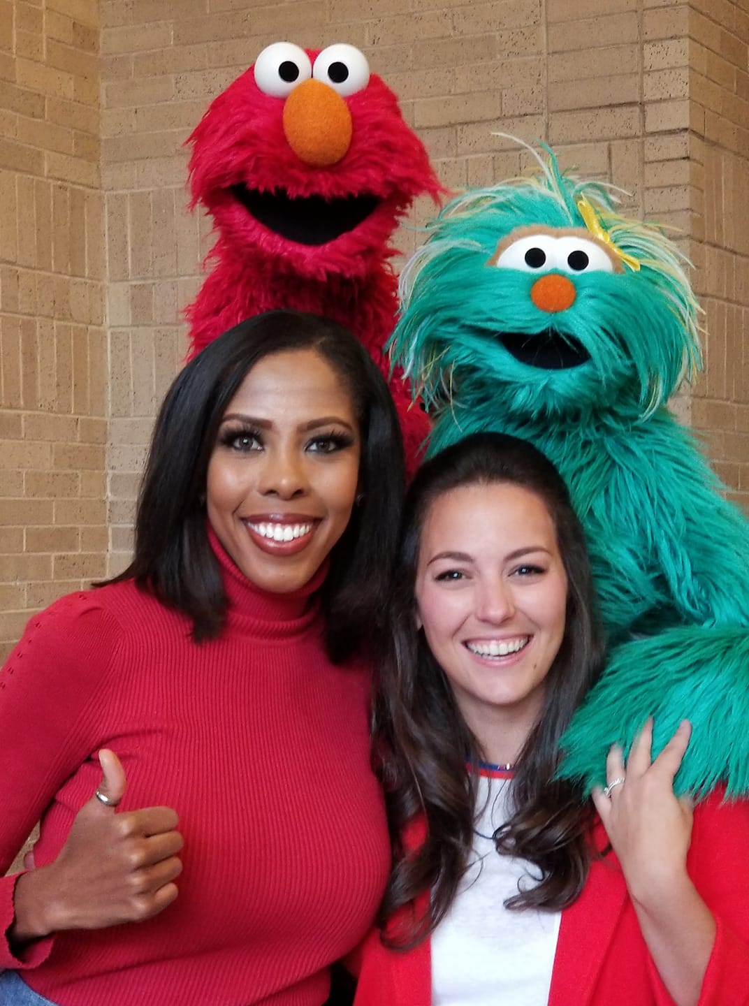 FOX4's Dhominique Ricks and Sesame Street's Elmo, Rosita and Nina pose together at Rock It!