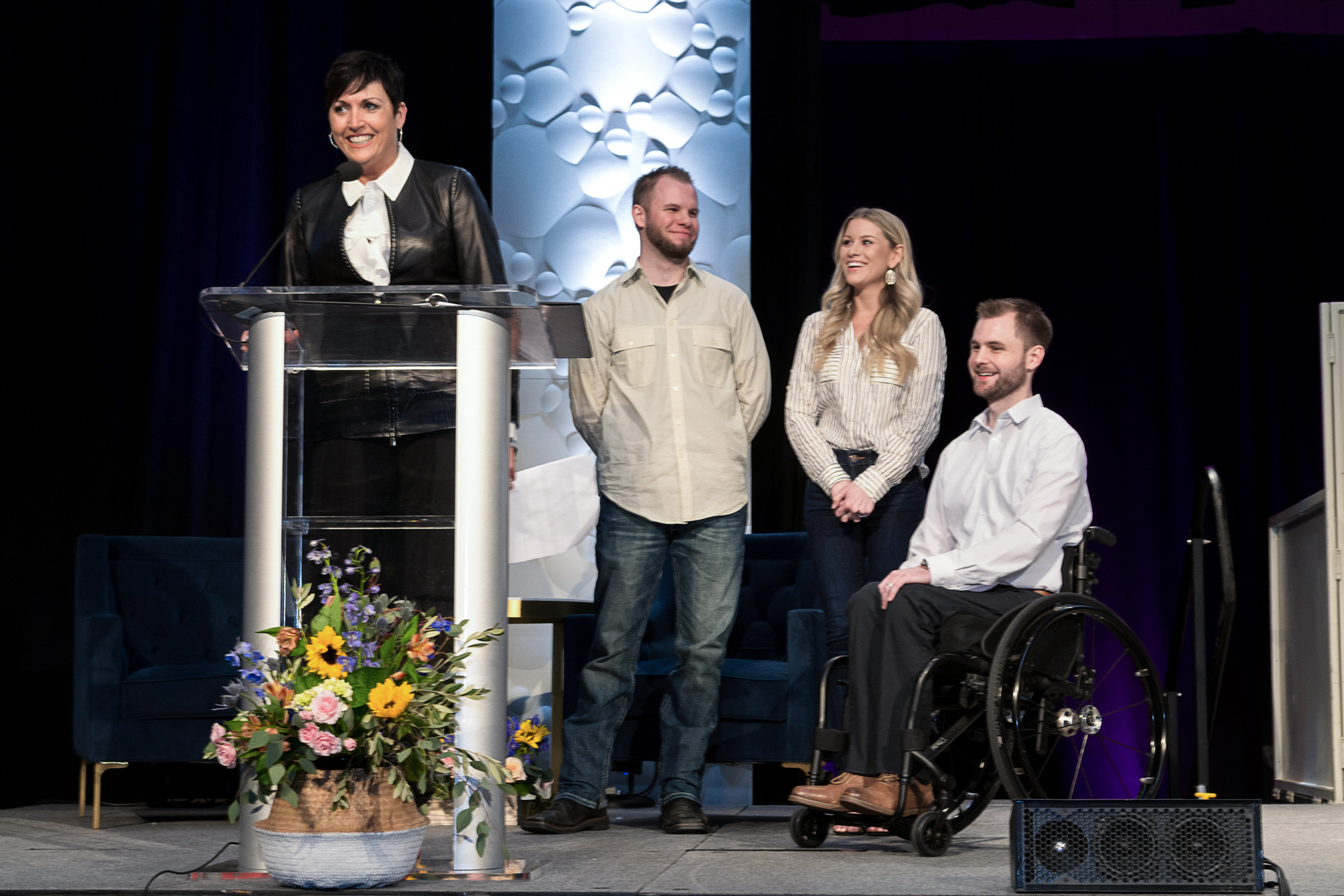 Family on stage at the 2018 Books and Boutique who shared their story about how Kansas City will benefit from Saint Luke's Rehabilitation Institute