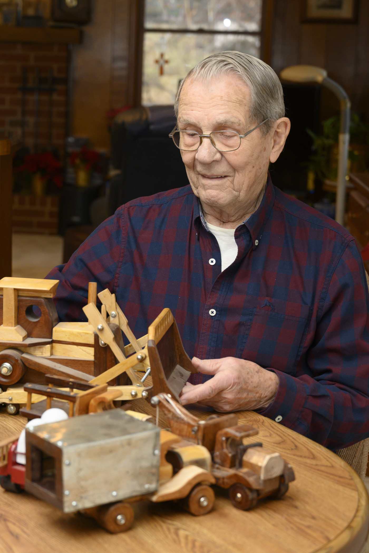 Carl with his handmade toy trucks