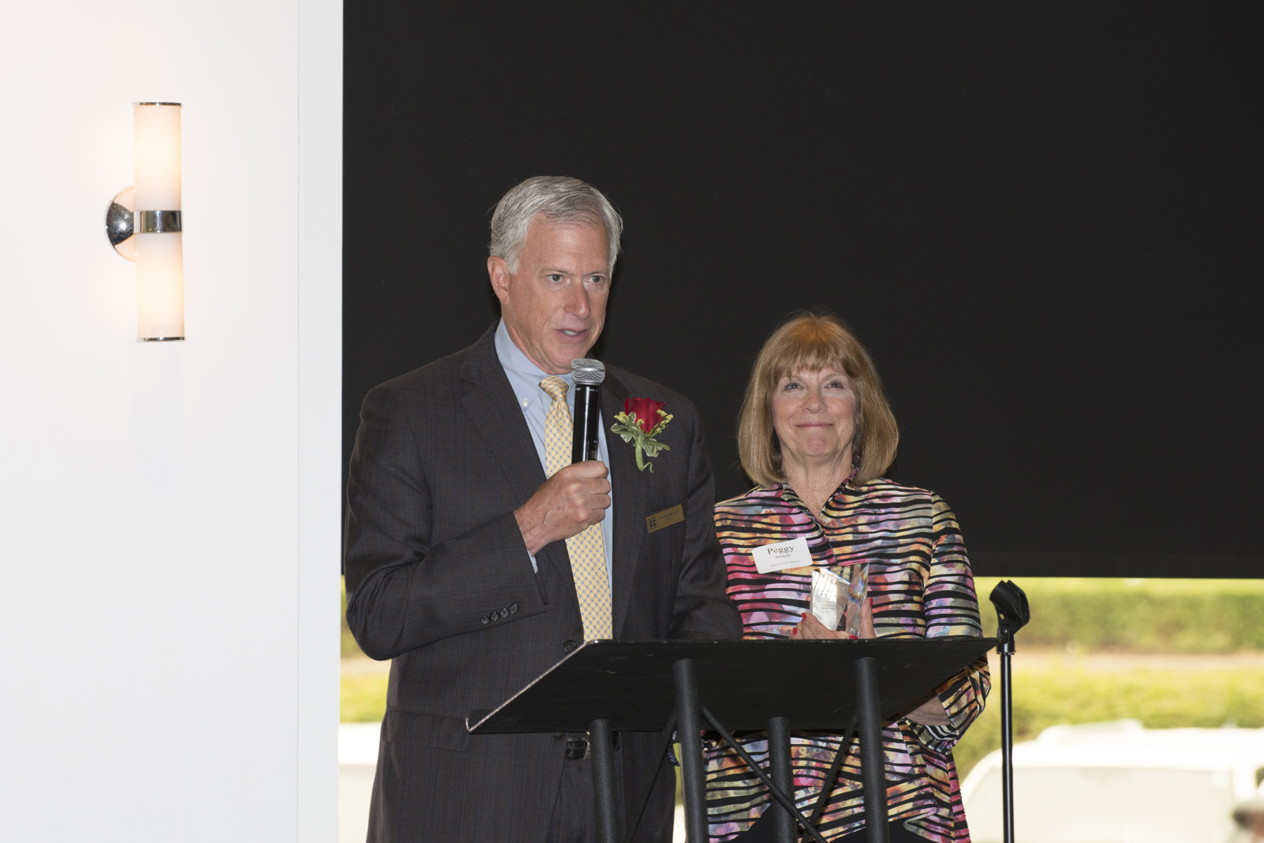Michael and Peggy Borkon speaking to the room after accepting the 2018 Foundation Fellow Award