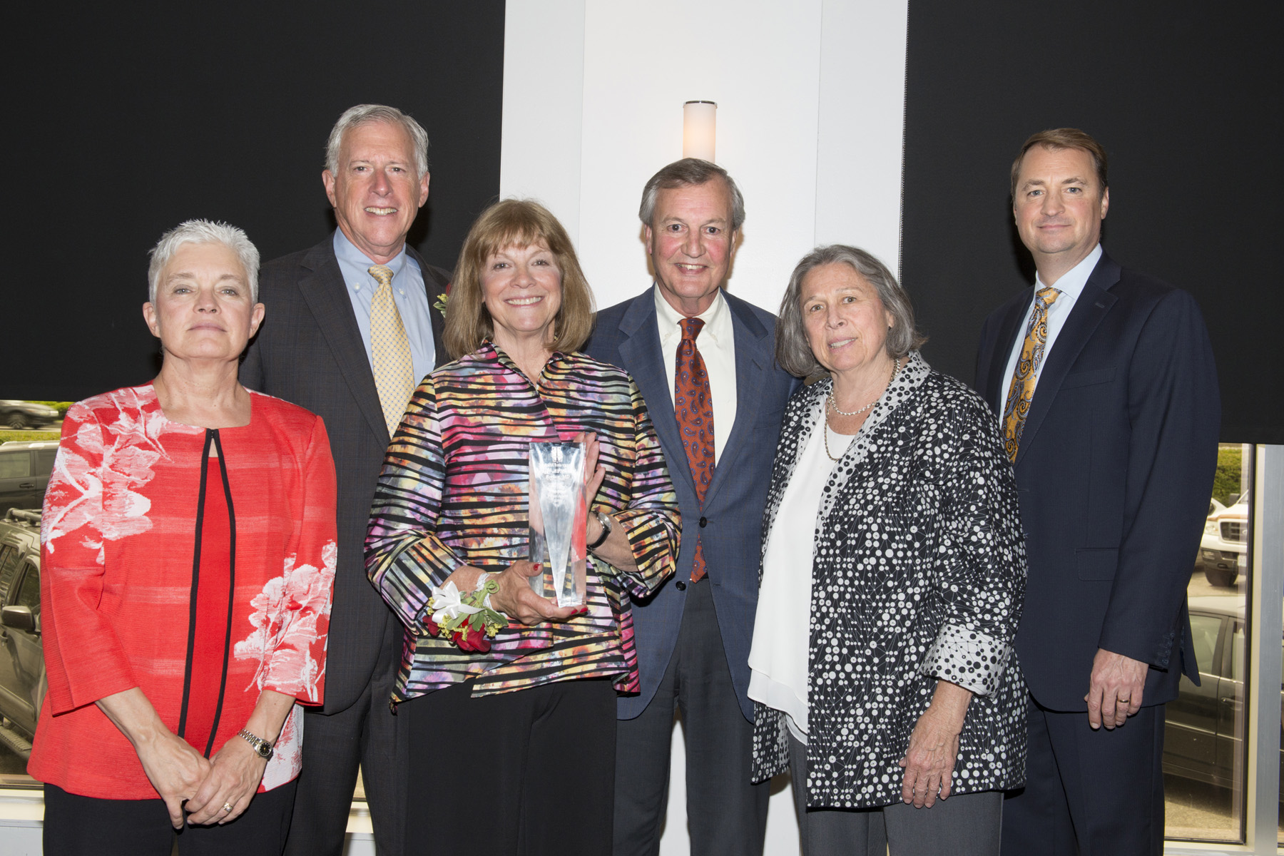 Michael and Peggy Borkon pose with Dr. Melinda Estes, the Wagstaff family and Michael VanDerfhoef with their Foundation Fellow Award