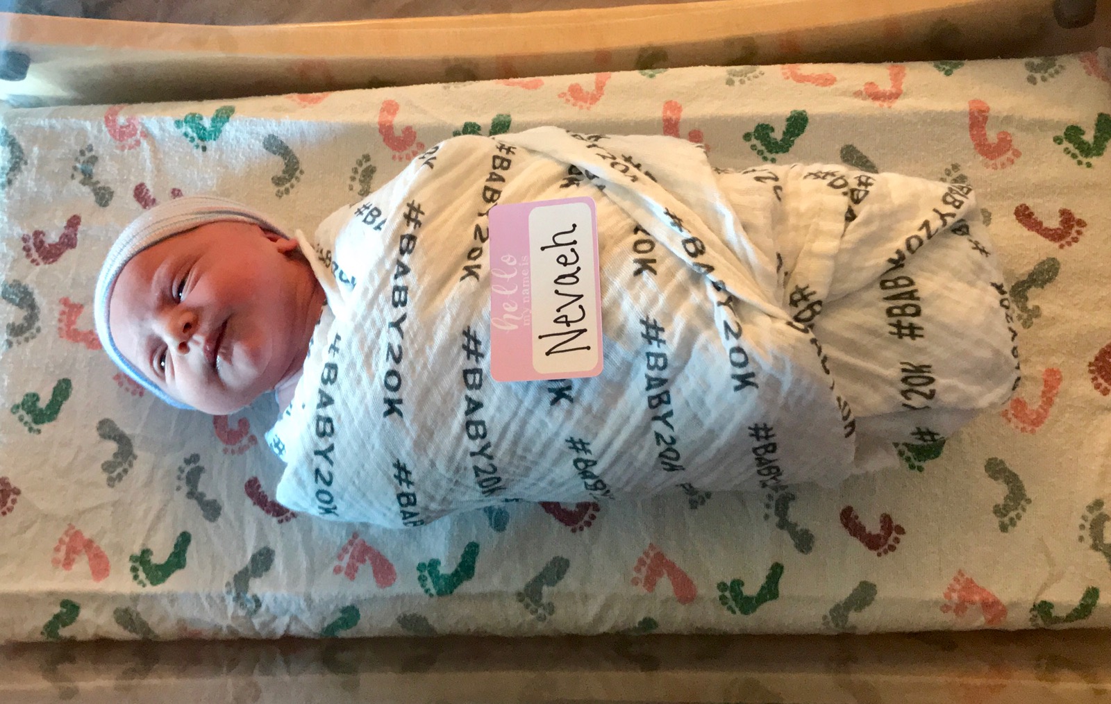 Nevaeh, Saint Luke's East Hospital 20,000th baby, swaddled in a special #baby20k swaddle