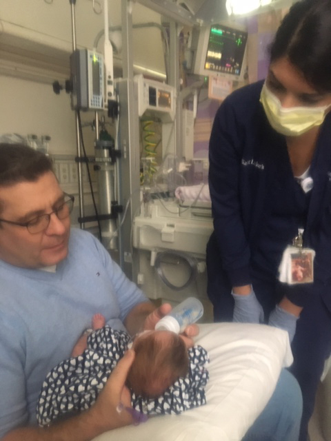Bruce Thoman in the NICU with his daughter, Lillian