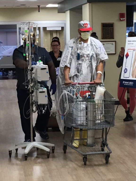 Christopher Williams walking in the hospital before his heart transplant