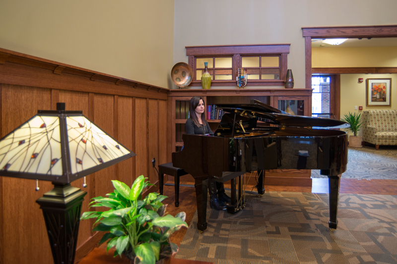 Baby grand piano in great room