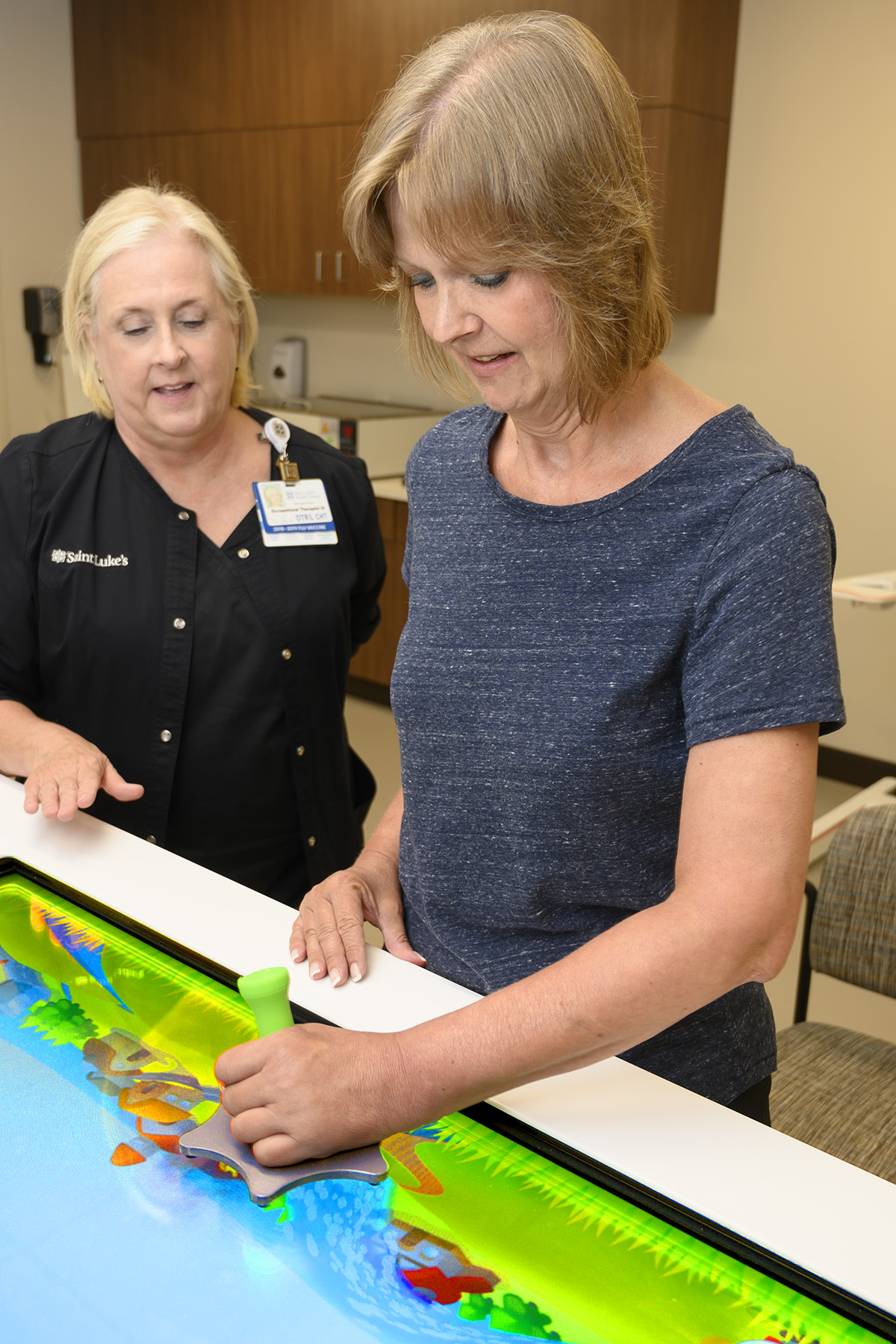 Susan Rushing working with her occupational therapist