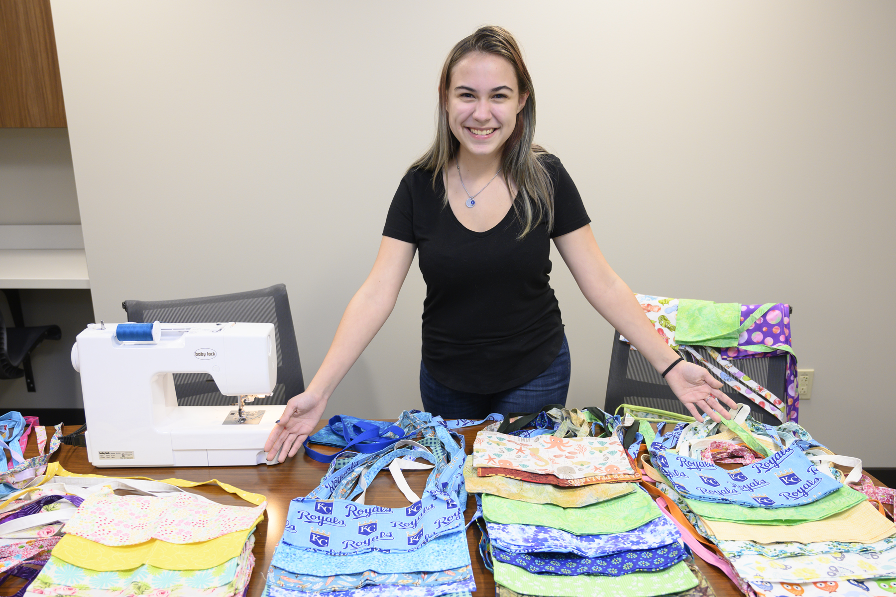 Cheri Rich in front of the many drain bags she has sewed for mastectomy patients