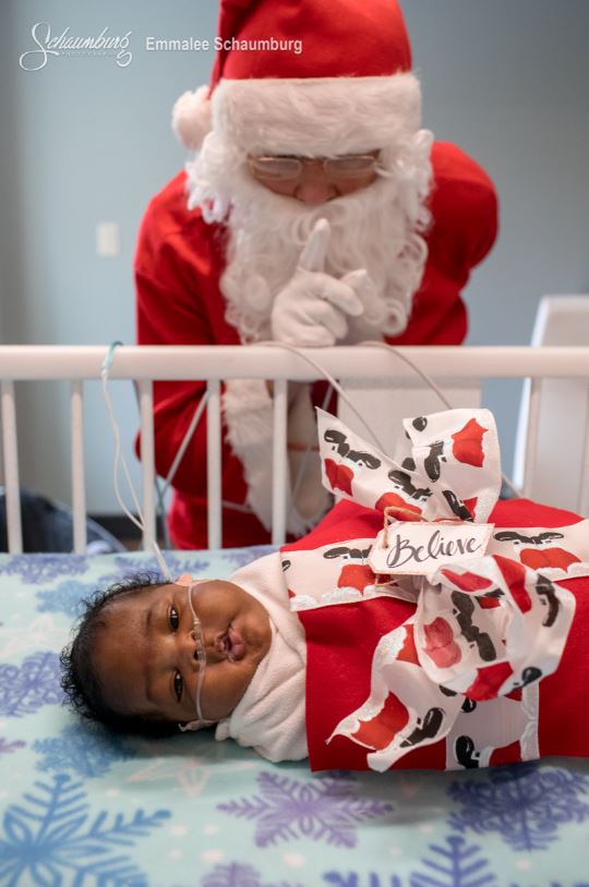 Santa next to baby in the NICU