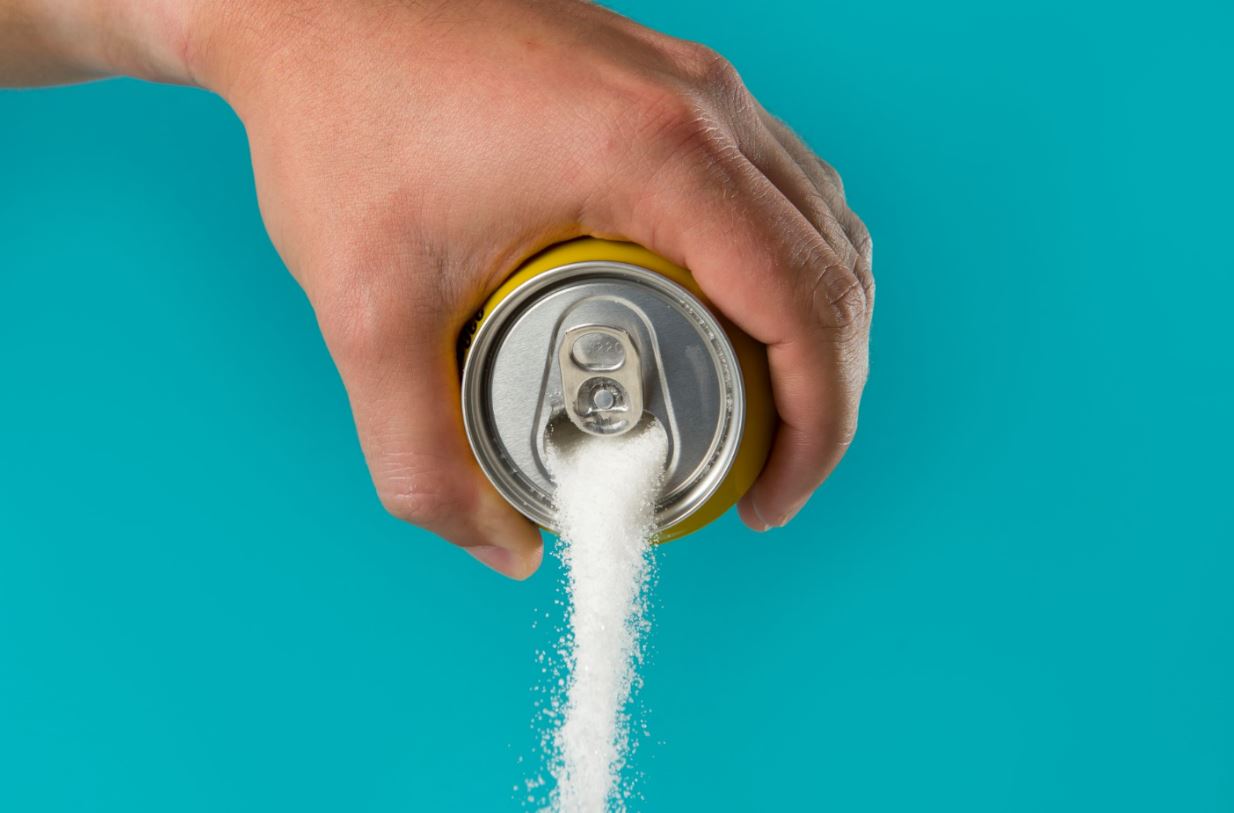 Sugar pouring out of soda can