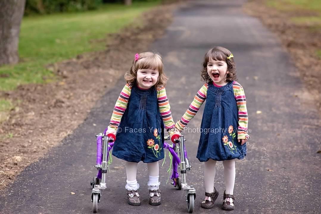 In October 2015, Amelia and her twin sister, Sarah, explored the walking trail in their neighborhood park. (Photo credit Faces You Love Photography/Helen Ransom)