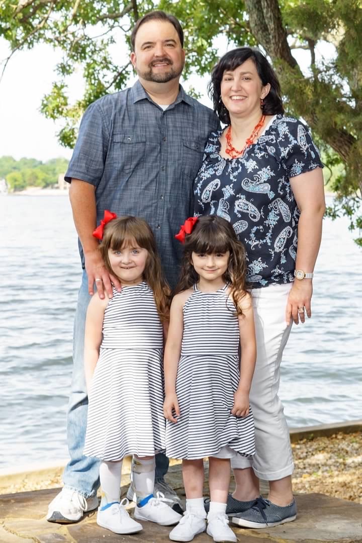Todd, Jennifer, Amelia and Sarah posing for a family photo at a family reunion in July 2017 when the girls were 4 1/2 years old. 