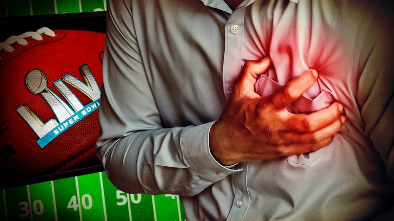 Man grabbing his heart next to LIV Super Bowl football