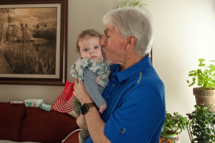 Ron Ricciardi holding his grandson