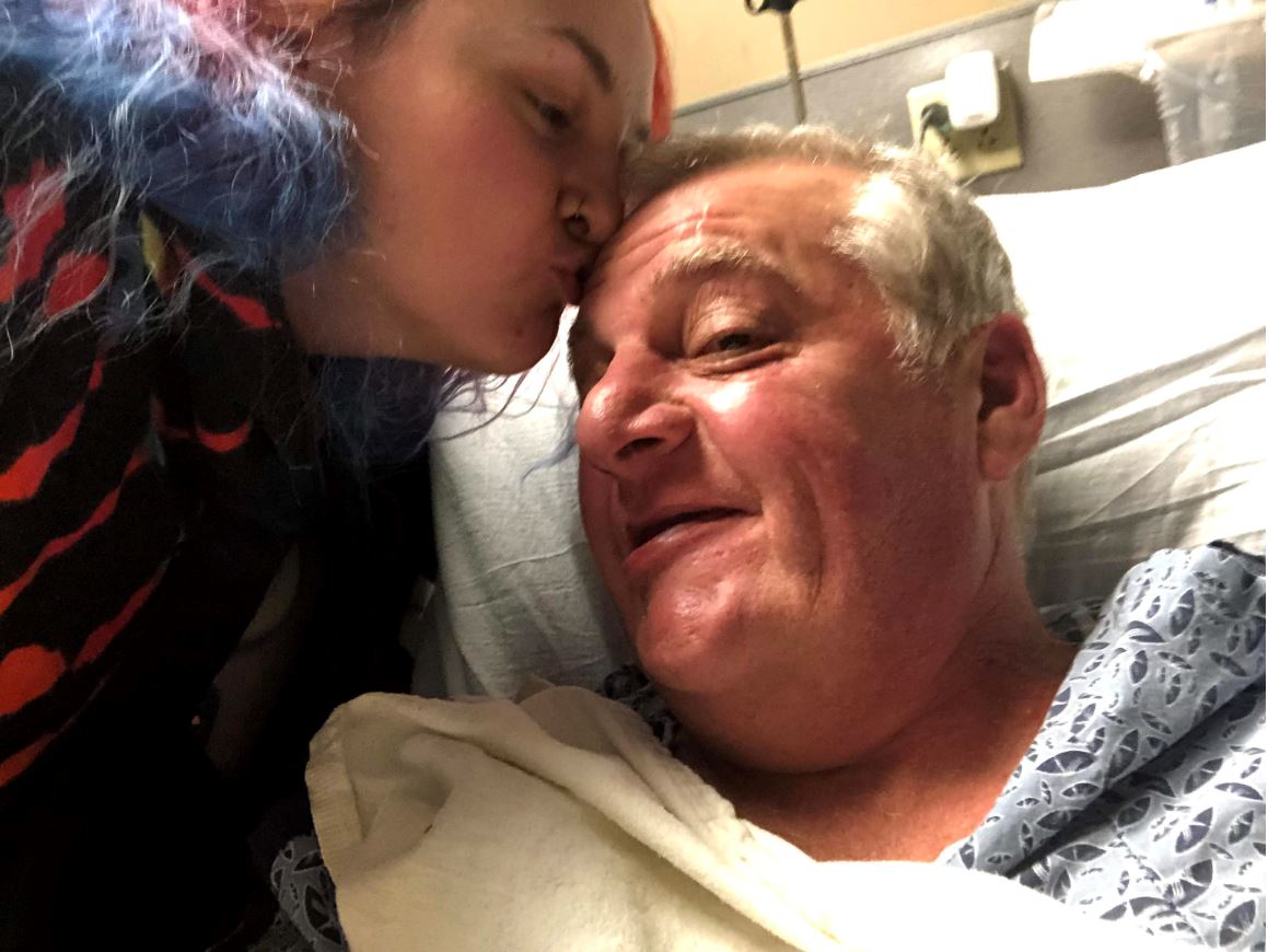 Birch and his daughter, Hannah at the hospital after his stroke