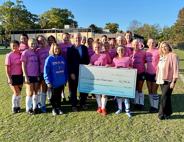 The Pembroke Hill Field Hockey Team holds a pink-out game to raise awareness and raise breast cancer funds. Pembroke head coach, Avery Hughes, is a breast cancer survivor.