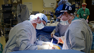 Two providers operating on patient undergoing heart transplant