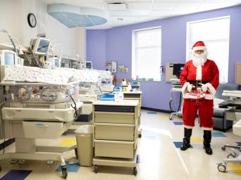 Sgt. Anthony Cook dressed up as Santa in the NICU