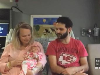 KCTV 5 News. Jennifer and Mark Pazirandeh holding their newborn, Mila Rose.