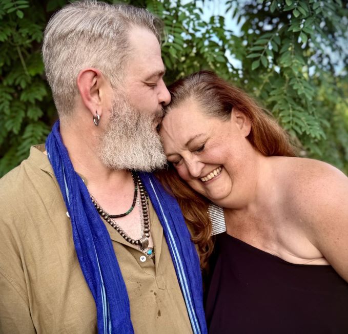 Eric kissing Elea on the forhead outside