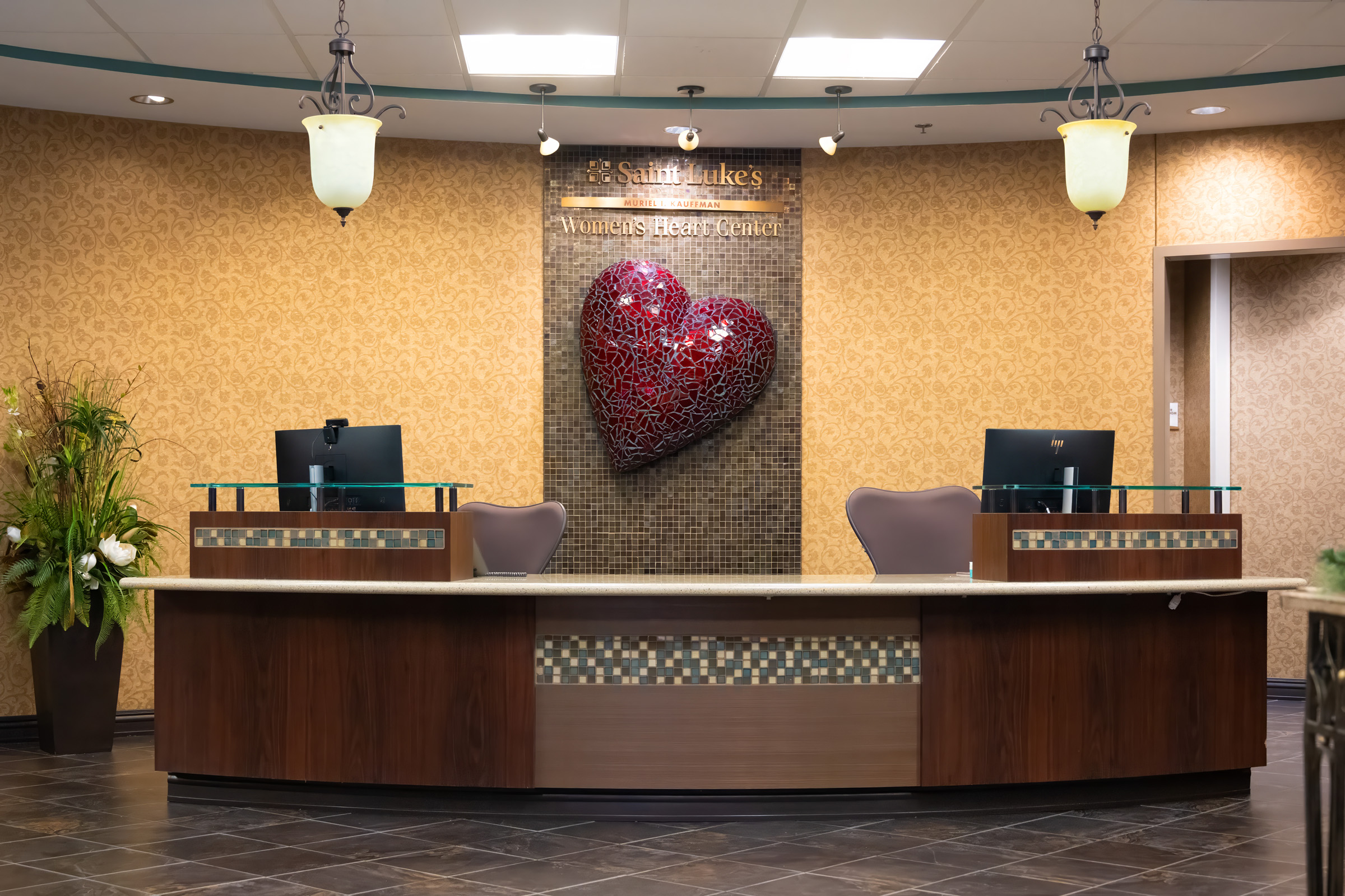 Desk at the women's heart center. Large heart behind the desk. 