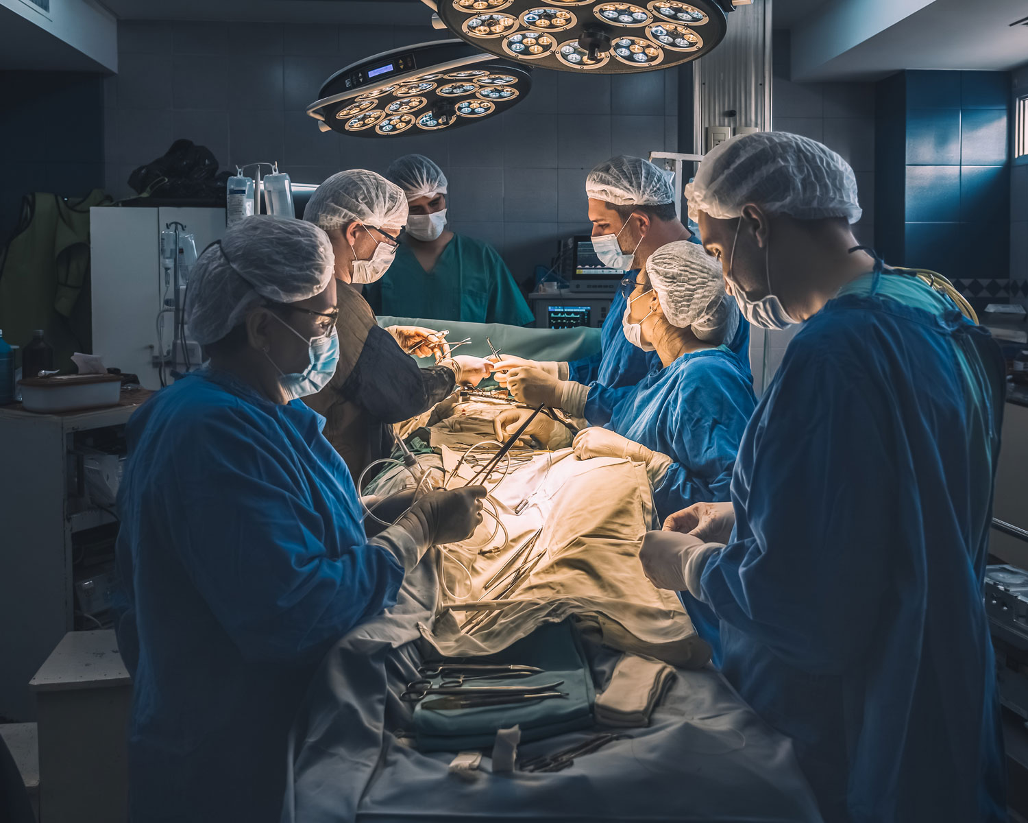 A heart surgery being performed by a team of hospital workers