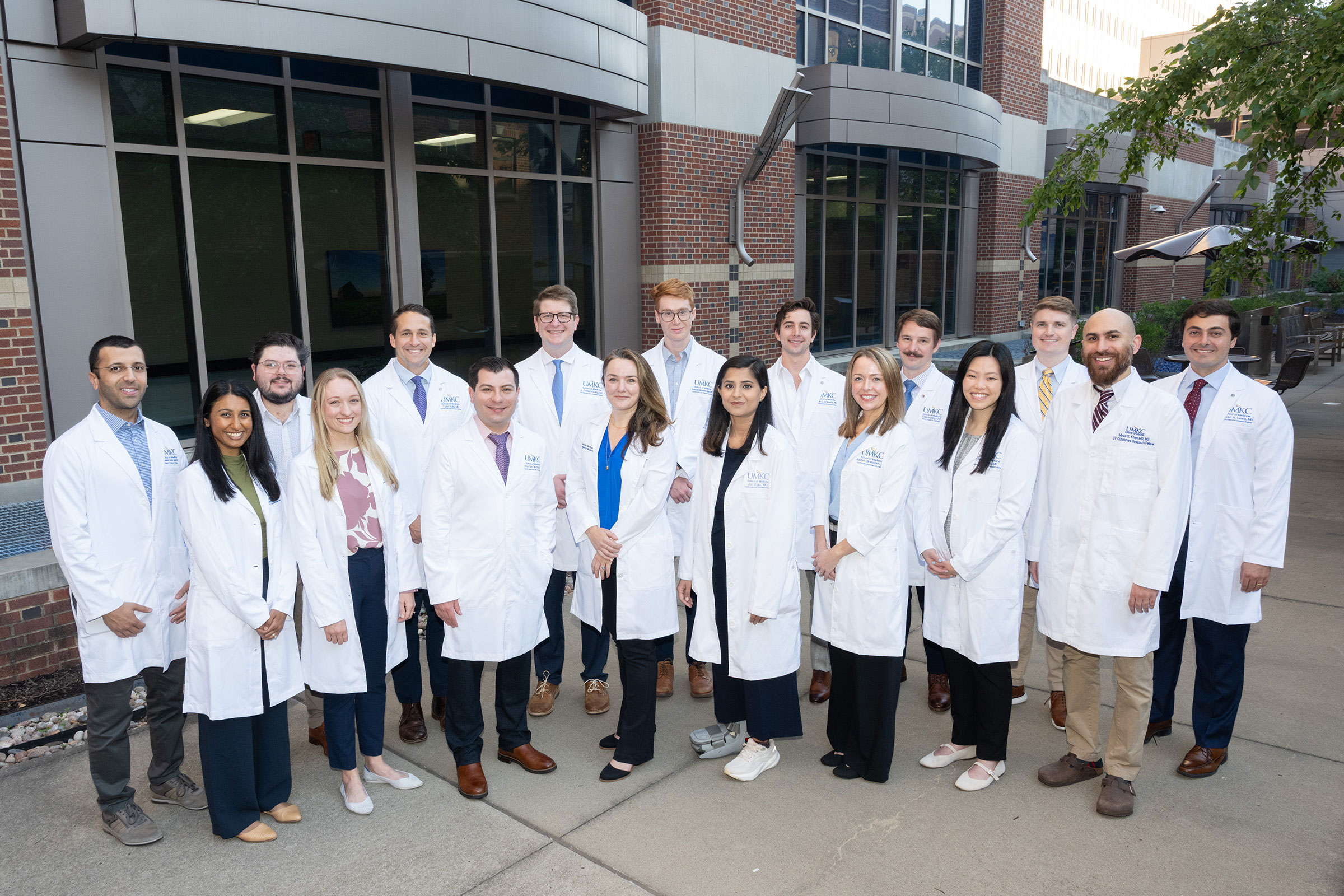 A group of cardiovascular fellows, standing outside Saint Luke's Hospital