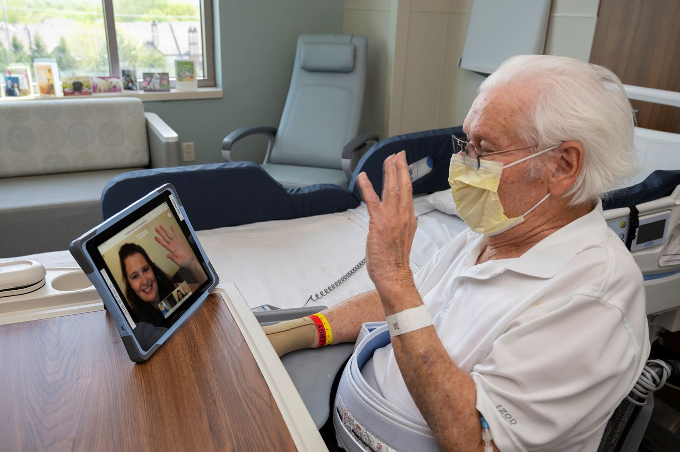 Don, a patient at Saint Luke's, connects with his daughter, Deb, on an iPad since she can't visit him in the hospital due to COVID-19.
