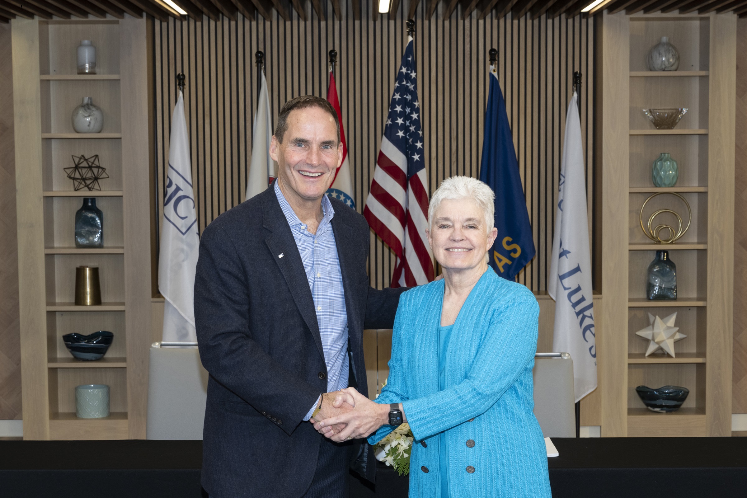 Dr. Melinda Estes, MD and Richard Liekweg make it official Saint Luke’s will join BJC. 