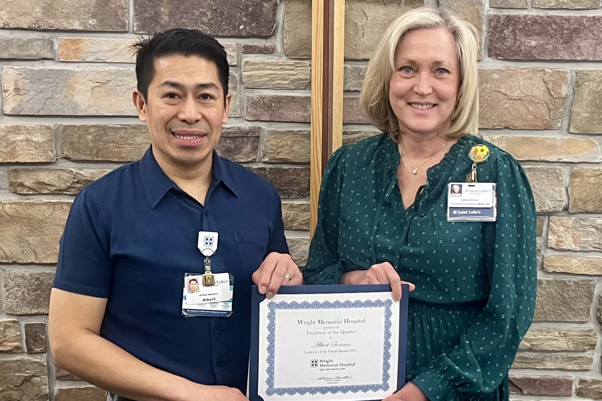 Albert Soriano (left) receives Wright Memorial Hospital Employee of the Quarter Award 2024 from Catherine Hamilton