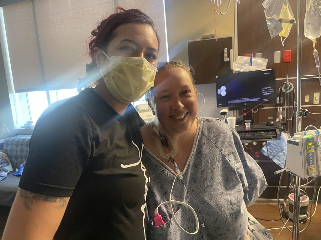 Patient Jo (right) and Candice half body shots, taken after transplant