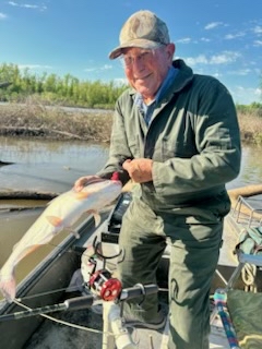 Dennis with a fish he caught.
