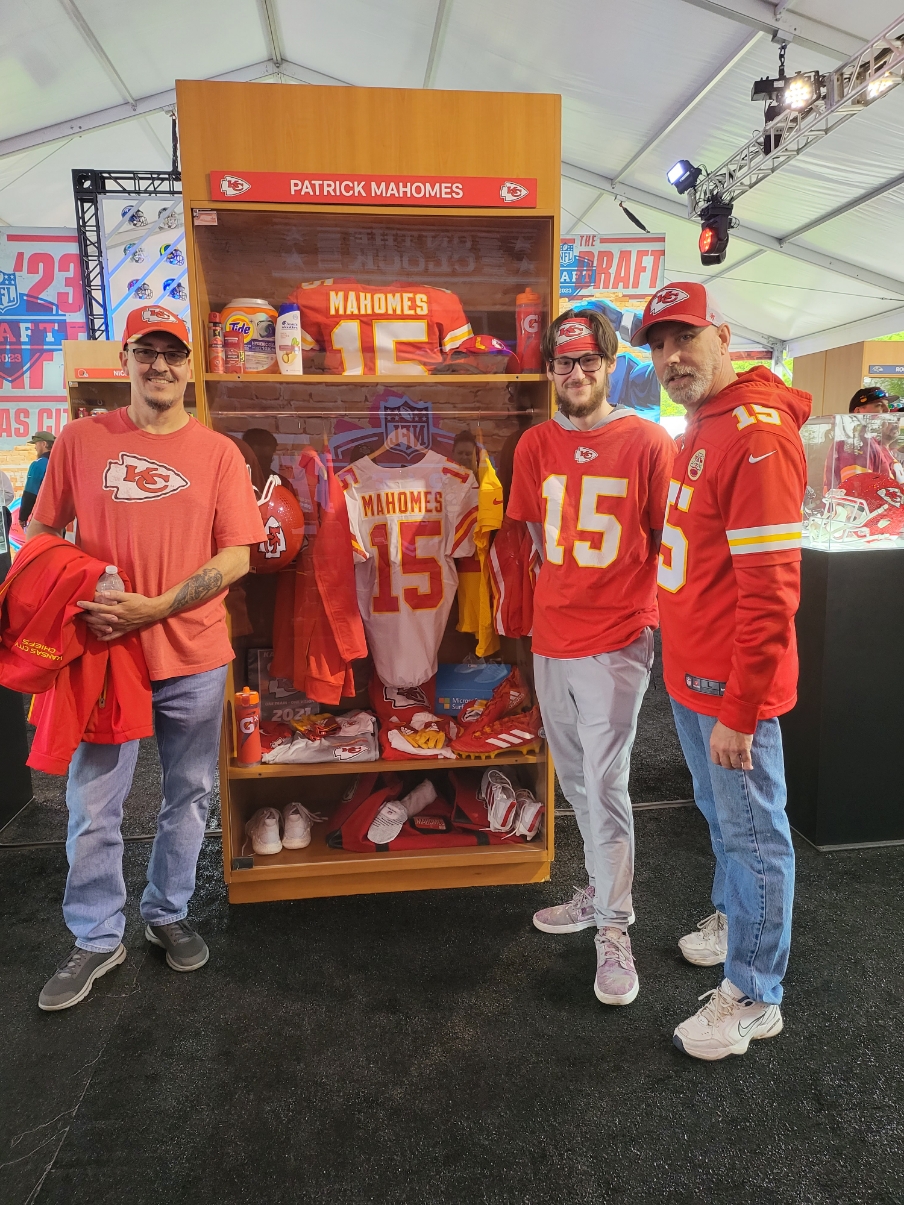 Patient Jimmie (right) in Chiefs sports wear with two other men 
