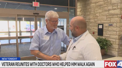 Patient shaking hands with the doctor who helped him. 